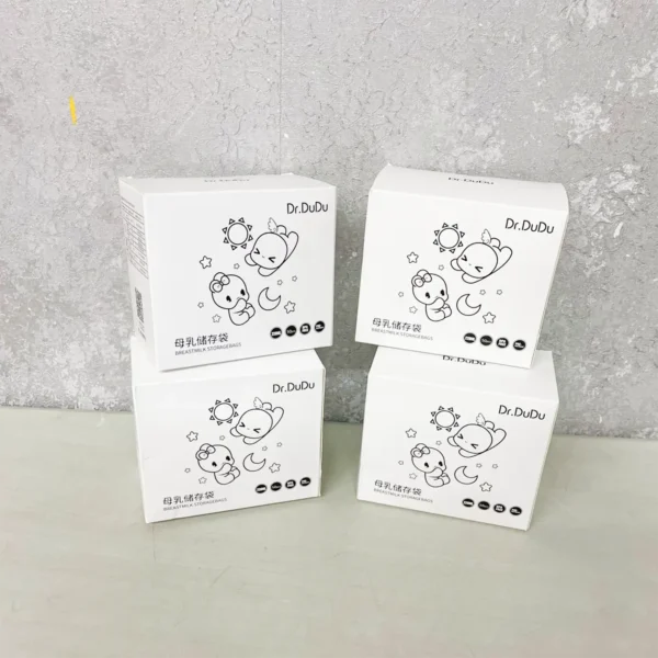 Image of Dr. Dudu Breastmilk Storage Bags featuring neatly stacked white boxes with cute illustrations, ideal for safe and convenient breastmilk storage.