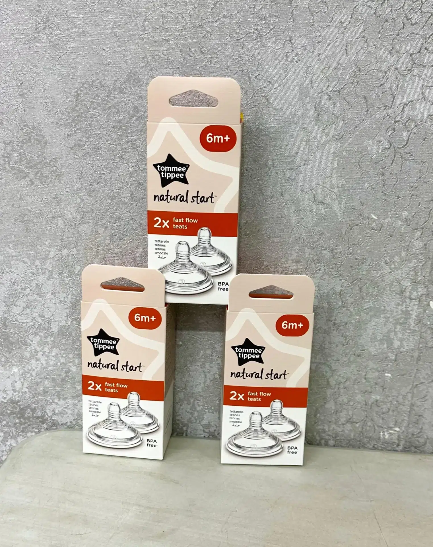 Tommie Tippee Natural Start Medium Flow Teats 2-pack for babies 3 months+, BPA-free silicone teats with anti-colic valve, displayed in retail packaging.