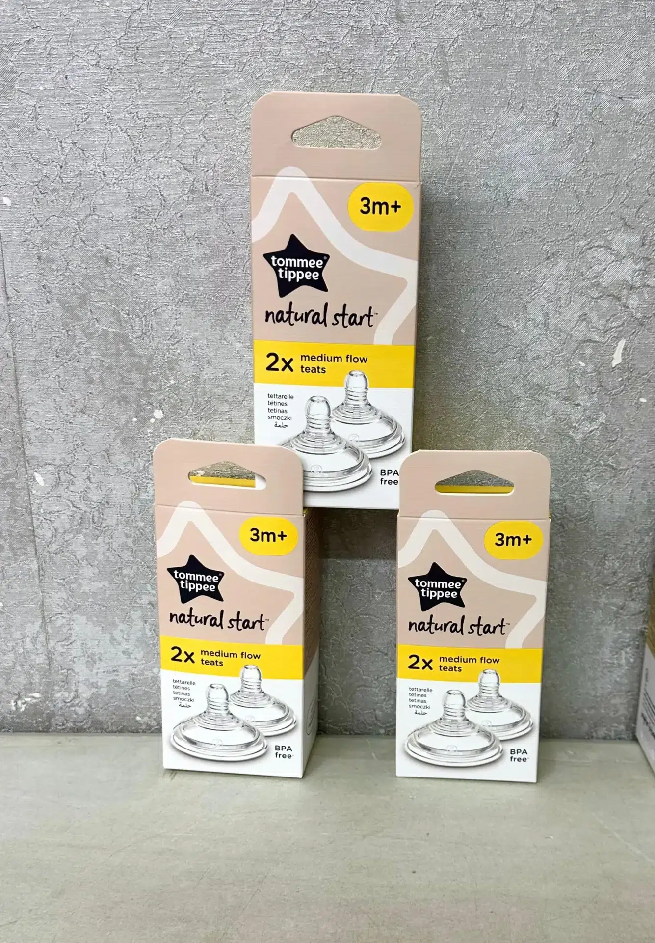 Tommie Tippee Natural Start Medium Flow Teats 2-pack for babies 3 months+, BPA-free silicone teats with anti-colic valve, displayed in retail packaging.